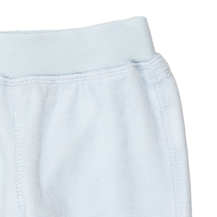 Fixoni. Lyseblå baby velourbuks, udsnit