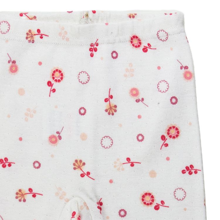 Absorba. Hvide sparkebukser til nyfødt. Blomsterprint. Nærfoto